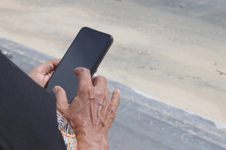 Senior playing on the phoneの写真素材