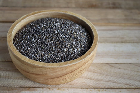 Chia seeds on brown wood backgroundの写真素材