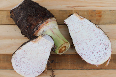 Fresh taro raw on wood background