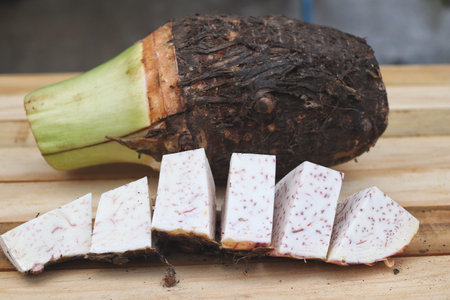 Fresh taro raw on wood background