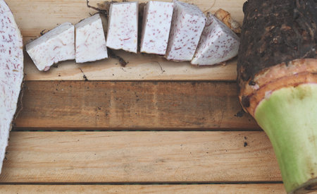 Fresh taro raw on wood backgroundの写真素材
