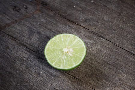 Green lime on wood background