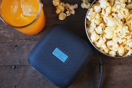 Bluetooth speaker on wood tableの写真素材