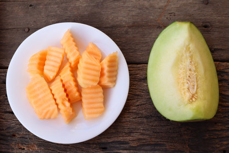 Green and orange melon halves