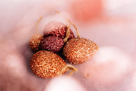 Easter eggs glitter orange red bokehの写真素材