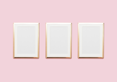 Golden frame mock up on pastel pink backgroundの写真素材