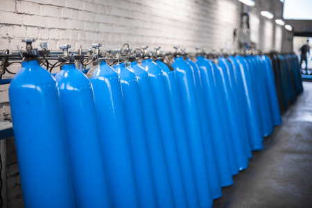 Oxygen cylinder with compressed gas. Blue Oxygen tanks for industry. Liquefied oxygen production. Factoryの写真素材