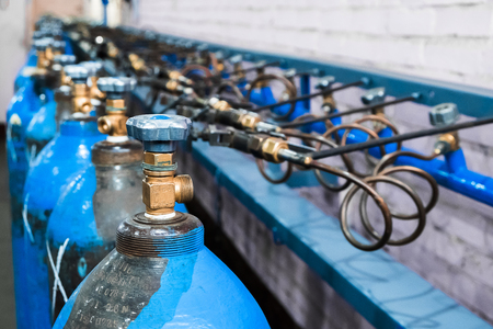 Oxygen cylinder with compressed gas. Blue Oxygen tanks for industry. Liquefied oxygen production. Factoryの写真素材