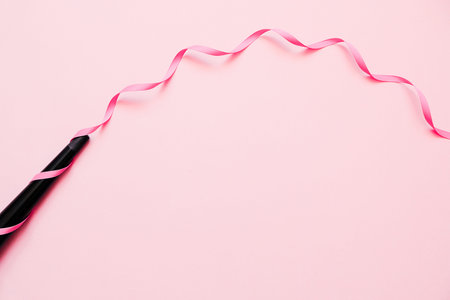 Cone curling wand iron. Professional hairdressers equipment on color background. Concept of curly hair styling.  Minimal Flay lay.の写真素材