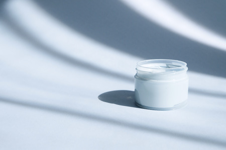 Flat lay with blue clay facel mask in jar. Beauty background with facial cosmetic products.
Spa concept. Beauty blogger, salon treatments concept. Minimalism.の写真素材