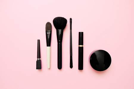 Flat lay of female fashion makeup products on pastel color background. Beauty and fashion conceptの写真素材