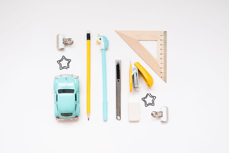 Blue and yellow school supplies isolated on white background. Back to school. Flat lay.