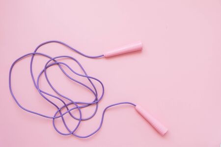 Jump or skipping rope on pink backgroundの写真素材