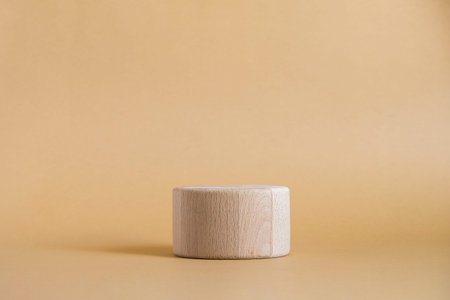 Wooden round cylinder shape on beige background. Minimal box and geometric podium. Scene with...