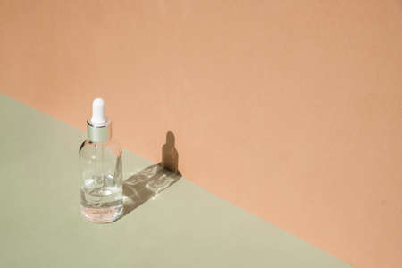 Dropper glass Bottle Mock-Up. Body treatment and spa. Natural beauty products. Eco cream, serum, skin care blank bottle. Anti-cellulite massage oil. Oily cosmetic pipetteの写真素材