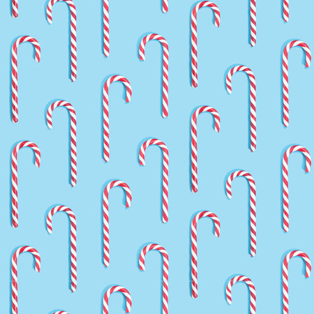 New year pattern made with Christmas candies on blue background. Minimal Christmas concept. Candy...