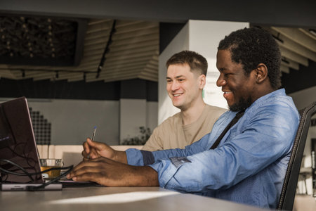 Two programmers working in the office of a software development company. Coding technologies, site...