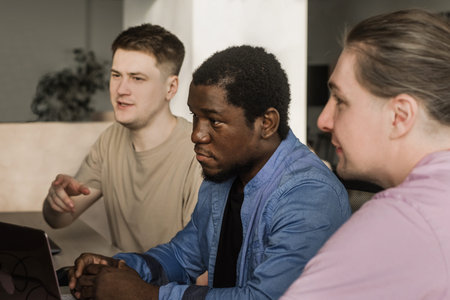 Team of professional software developer and brainstorming and programming on site, software and...
