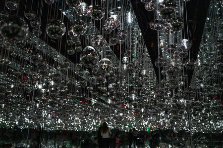 Experience the Mesmerizing Silver Light Reflection that features Beautiful Hanging Orbsの写真素材