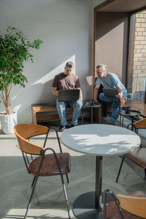 Two knowledgeable professionals collaborating effectively together in a modern workspace setting