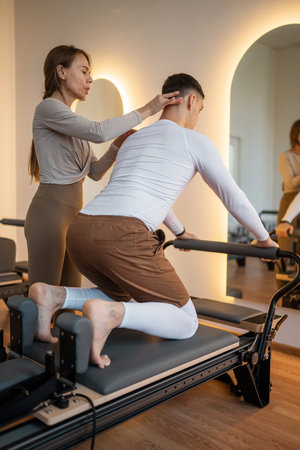 Engaging Pilates Training Sessions Held in a Stylish and Modern Studio Environment
