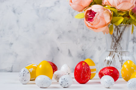 Easter card with colored eggs on a light background. Happy easter concept.Copy space.