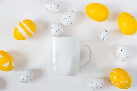 White mug mockup on a light background. Easter holiday concept.の写真素材