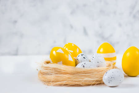 Easter card with colored eggs on a light background. Happy easter concept.Copy space.の写真素材
