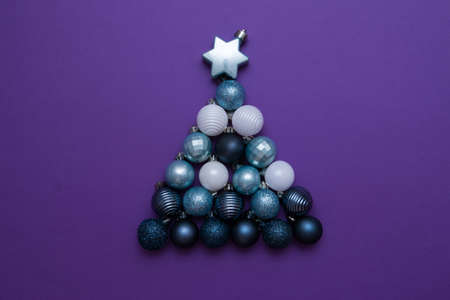 Creative Christmas tree made from Christmas balls. New Year card, top view, flat lay.の写真素材