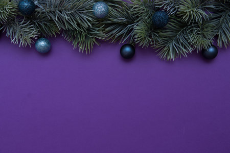 Christmas tree branch decorated with Christmas balls. New Year card, top view, flat lay.の写真素材