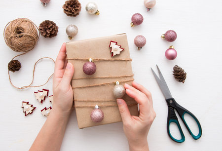 Christmas decorations and gift box on a light background. view from above.