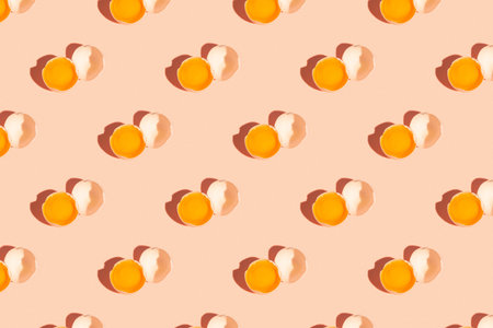 Seamless regular pattern of fresh eggs on a pastel orange background. hard light. Easter holiday...