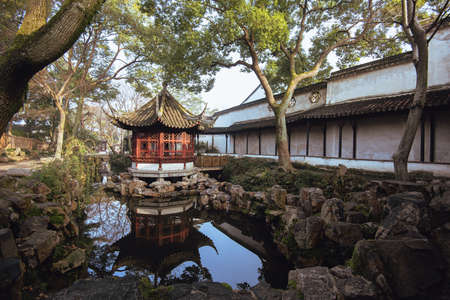 The pavilion at Humble Administrator Garden(Zhuozheng Garden) in a mist early morning.Zhuozheng Garden a classical garden,a UNESCO World Heritage Site and is the most famous of the gardens of Suzhou.のeditorial素材