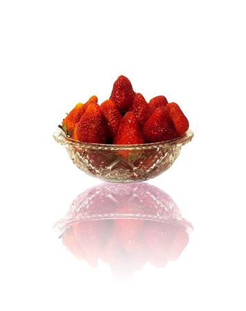 A glass dish with delicious and fresh strawberriesの写真素材