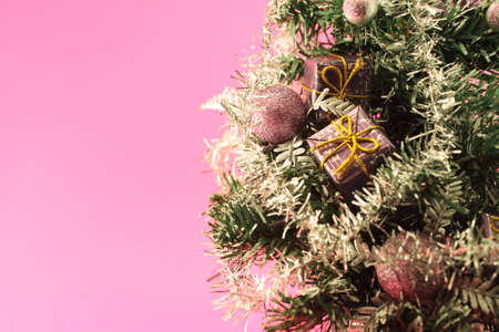 Christmas tree with decorations on pinkの写真素材