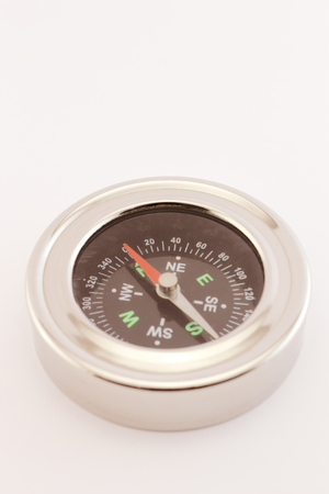 A compass isolated on a white background.の写真素材