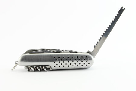 Saw. Steel pocket knife with multi-tool, isolated on white background