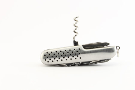 Corkscrew. Steel pocket knife with multi-tool, isolated on white background