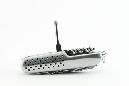 Screwdriver. Steel pocket knife with multi-tool, isolated on white background
