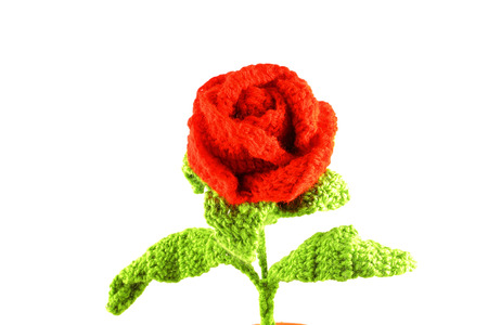 Close-up view of a red rose wool  Handicrafts made ââof woven wool with crochet technique の写真素材