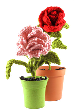 Red rose and carnation pink wool in a pot  Handicrafts made ââof woven wool with crochet technique の写真素材