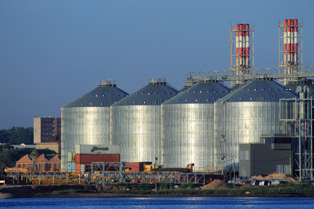 Four large silos for grain storage located on the bay, near the port of Montevideo, Uruguay.のeditorial素材