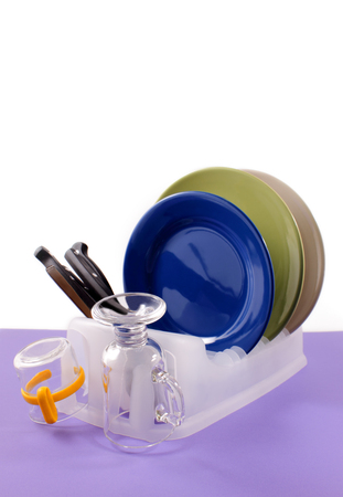 Kitchen dishes washed, drying in the drainer.の写真素材