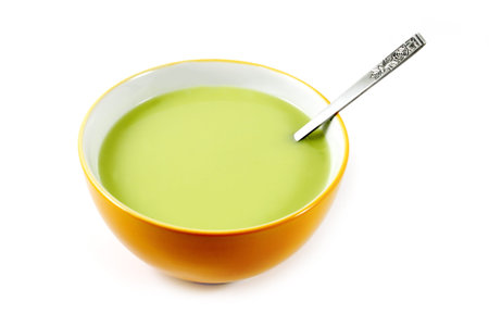 Pea soup in a bowl isolated on white backgroundの写真素材