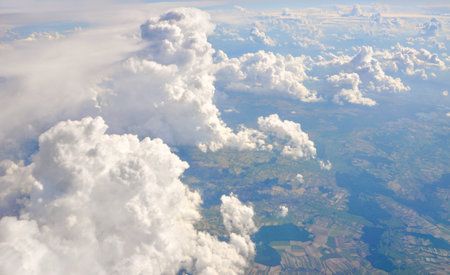 Clouds and earth from the height of the flight of the aircraft.