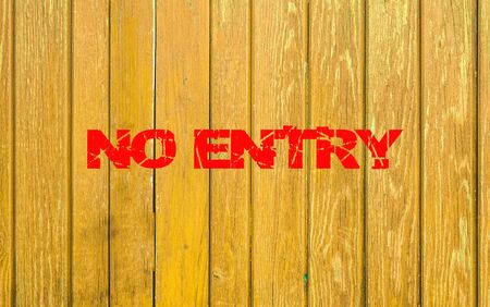 The inscription no entry on a wooden fence.の写真素材