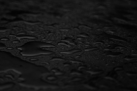 Abstract dark background, black water at night.