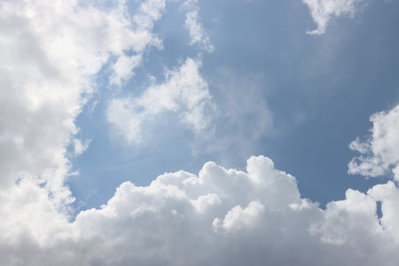 White clouds in the blue sky. Atmospheric background.