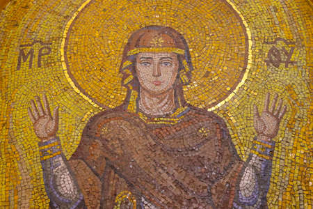 Holy Mary. Unbreakable wall mosaic in a Christian church.の写真素材