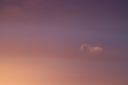 Illuminated sky by the rays of the sun, during sunrise.